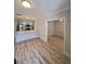 Open concept living room with kitchen and wood-look floors at 714 Siena Palm Dr # 203, Celebration, FL 34747