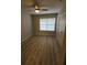 Bright bedroom with ceiling fan and wood-look floors at 714 Siena Palm Dr # 203, Celebration, FL 34747