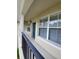 Private balcony with teal door and seating at 714 Siena Palm Dr # 203, Celebration, FL 34747