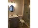 Updated bathroom with gray vanity, white toilet, and walk-in shower at 714 Siena Palm Dr # 203, Celebration, FL 34747