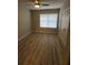 Bright bedroom with ceiling fan and wood-look floors at 714 Siena Palm Dr # 203, Celebration, FL 34747