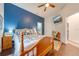 Spacious bedroom with wood floors and a blue accent wall at 4450 Kaiser Ave, St Cloud, FL 34772