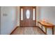 Entryway with wood door, tile floor, and console table at 4450 Kaiser Ave, St Cloud, FL 34772