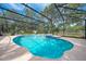 Large kidney-shaped pool with spa and screened enclosure at 4450 Kaiser Ave, St Cloud, FL 34772