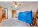 Simple bedroom with large windows and ceiling fan at 4450 Kaiser Ave, St Cloud, FL 34772