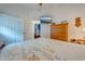 Bright bedroom with a comfortable bed, ample closet space, and a view of another room at 4450 Kaiser Ave, St Cloud, FL 34772