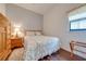 Light and airy bedroom with wood floors and a dresser at 4450 Kaiser Ave, St Cloud, FL 34772