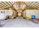 Interior of barn with multiple stalls and wide aisles at 4450 Kaiser Ave, St Cloud, FL 34772