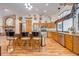 Kitchen with island, wood cabinets, and granite countertops at 4450 Kaiser Ave, St Cloud, FL 34772