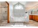 Elegant bathroom with a large soaking tub, double vanity, and walk-in shower at 4450 Kaiser Ave, St Cloud, FL 34772