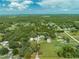 Aerial view of property with large lot, showing home, outbuildings and surrounding area at 4450 Kaiser Ave, St Cloud, FL 34772