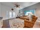 Cozy living room with hardwood floors and view to patio at 4450 Kaiser Ave, St Cloud, FL 34772