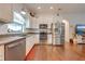 Bright kitchen featuring stainless steel appliances and wood flooring at 4450 Kaiser Ave, St Cloud, FL 34772