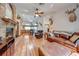 Open living space with hardwood floors and kitchen view at 4450 Kaiser Ave, St Cloud, FL 34772