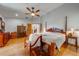 Main bedroom with hardwood floors and a large bed at 4450 Kaiser Ave, St Cloud, FL 34772