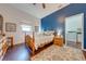 Cozy bedroom with wood flooring and a ceiling fan at 4450 Kaiser Ave, St Cloud, FL 34772