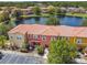 Aerial of townhomes near lake, showing community layout at 4706 Flagler Beach Way, Kissimmee, FL 34746