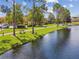 Scenic lakeside community with walking paths and lush landscaping at 4706 Flagler Beach Way, Kissimmee, FL 34746