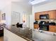 Kitchen boasts granite countertops, modern appliances, and ample cabinetry at 8125 Resort Village Dr # 51104, Orlando, FL 32821