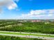 Aerial view showing the surrounding landscape and highway at 8125 Resort Village Dr # 51104, Orlando, FL 32821