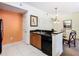 Well-equipped kitchen featuring granite countertops and modern appliances at 8125 Resort Village Dr # 51104, Orlando, FL 32821