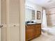 Clean bathroom with granite vanity and tub shower combo at 8125 Resort Village Dr # 51104, Orlando, FL 32821