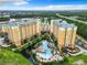 Multiple high-rise buildings with resort pool and surrounding landscape at 8125 Resort Village Dr # 51104, Orlando, FL 32821