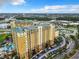 Aerial view of an apartment building with parking and a pool at 8125 Resort Village Dr # 51104, Orlando, FL 32821
