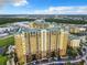Aerial view of an apartment building with parking at 8125 Resort Village Dr # 51104, Orlando, FL 32821