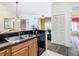 Open kitchen with granite countertops and stainless steel appliances at 8125 Resort Village Dr # 51104, Orlando, FL 32821
