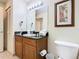 Bathroom with granite countertop and updated fixtures at 8125 Resort Village Dr # 51104, Orlando, FL 32821