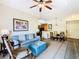Spacious living room with sofa, chair, and open floor plan at 8125 Resort Village Dr # 51104, Orlando, FL 32821