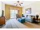 Comfortable living room with sofa, chair, and access to a balcony at 8125 Resort Village Dr # 51104, Orlando, FL 32821