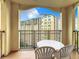 Private balcony with table and chairs overlooking resort amenities at 8125 Resort Village Dr # 51104, Orlando, FL 32821