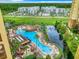Resort-style pool with pirate ship water feature and surrounding landscape at 8125 Resort Village Dr # 51104, Orlando, FL 32821