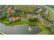 Aerial view showing community amenities and surrounding landscape at 8612 La Isla Dr, Kissimmee, FL 34747