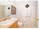 Clean bathroom with a shower, toilet, and vanity at 8612 La Isla Dr, Kissimmee, FL 34747