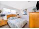 Main bedroom with a king-size bed and wood dresser at 8612 La Isla Dr, Kissimmee, FL 34747