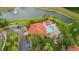 Community overview featuring pool, lake, and landscaping at 8612 La Isla Dr, Kissimmee, FL 34747