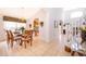 Dining room with a wooden table and chairs, adjacent to kitchen at 8612 La Isla Dr, Kissimmee, FL 34747