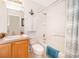 Bathroom with shower/tub combo and light wood vanity at 8612 La Isla Dr, Kissimmee, FL 34747