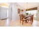 Dining room with wooden table and chairs near the entrance at 8612 La Isla Dr, Kissimmee, FL 34747