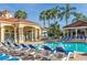 Community pool with adjacent clubhouse and lounge area at 8612 La Isla Dr, Kissimmee, FL 34747