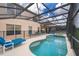 Inviting screened pool and spa, perfect for outdoor enjoyment at 8612 La Isla Dr, Kissimmee, FL 34747