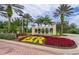 Lush landscaping at the entrance of Emerald Island Resort at 8612 La Isla Dr, Kissimmee, FL 34747
