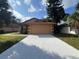 Cute one-story home with attached garage and well-maintained landscaping at 3180 Owassa Ct, Kissimmee, FL 34746