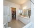 Bathroom with double vanity, walk-in closet and tub at 3593 Conroy Rd # 437, Orlando, FL 32839