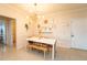 Bright dining room with white table and bench seating at 3593 Conroy Rd # 437, Orlando, FL 32839
