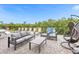 Spacious patio with seating area and game options at 494 Muirfield Loop, Reunion, FL 34747