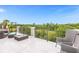 Spacious balcony with outdoor furniture and tranquil nature views at 494 Muirfield Loop, Reunion, FL 34747